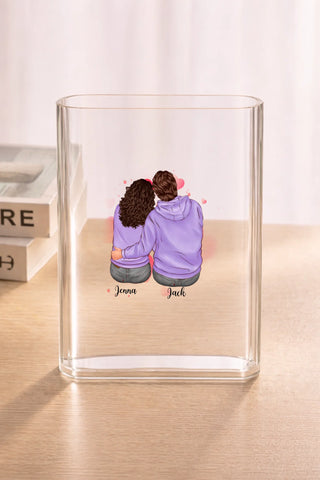 Clear acrylic vase on wood surface