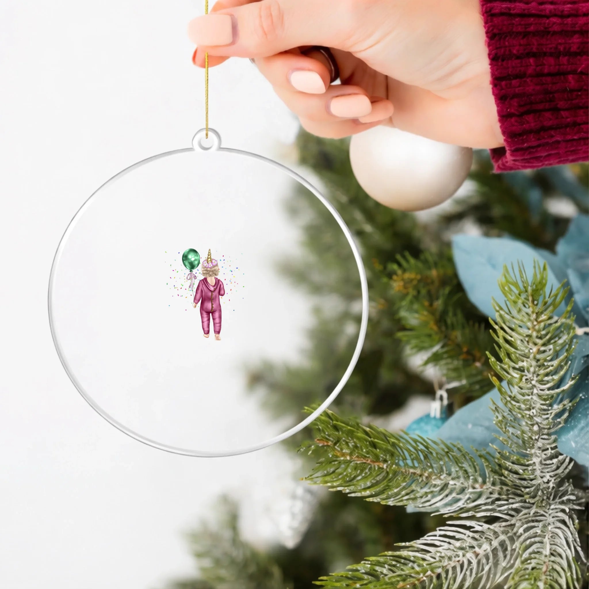 Clear acrylic ornament in hand